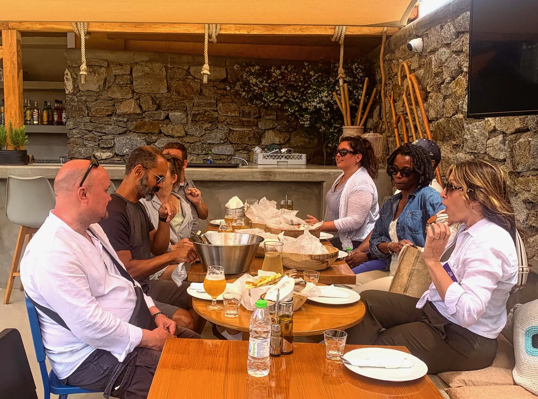 Guests sharing a Mykonian table